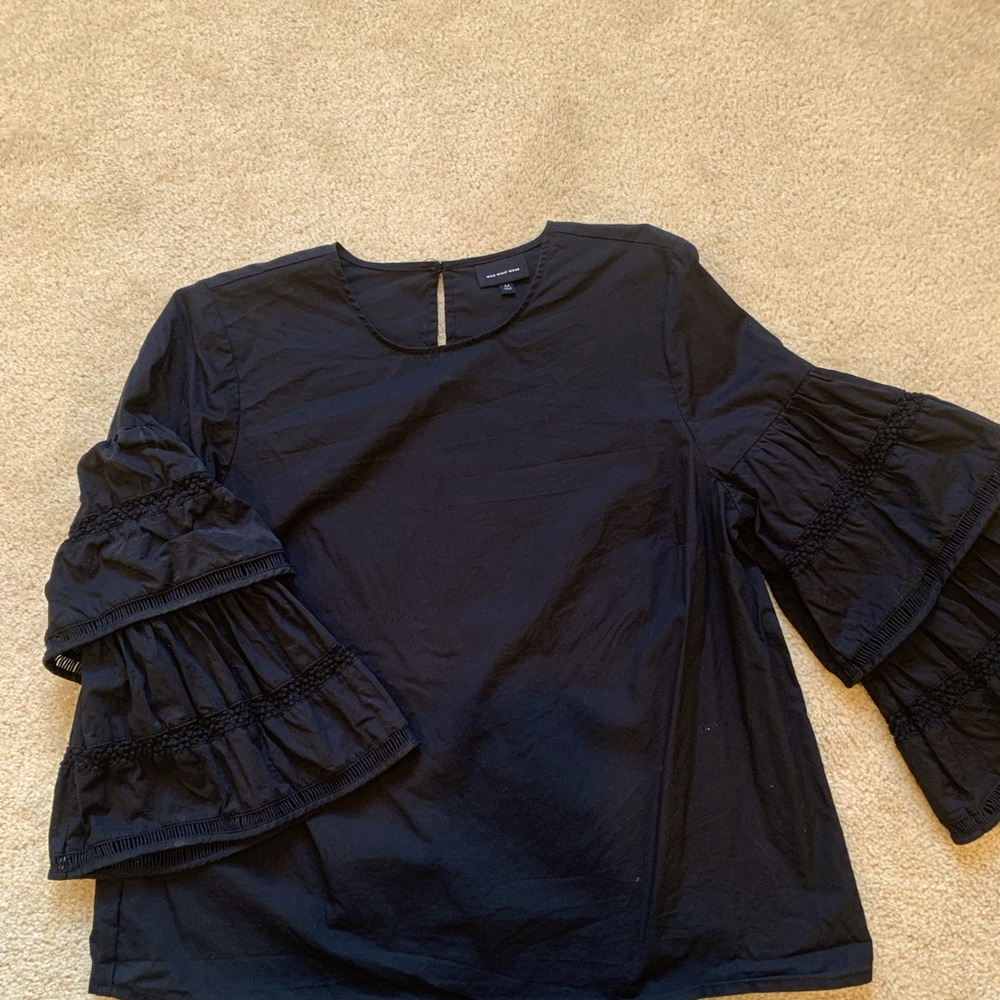 Black ruffle sleeve cotton blouse .